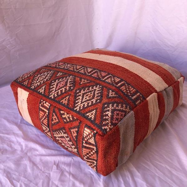 Red moroccan poufs